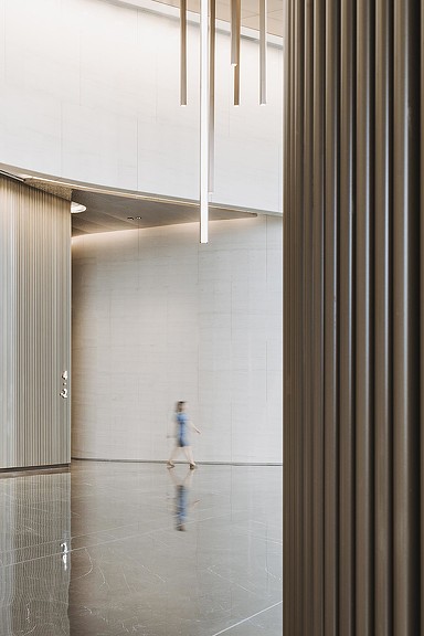 A child walking in a hallway.